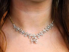 antique diamond bow necklace on neck