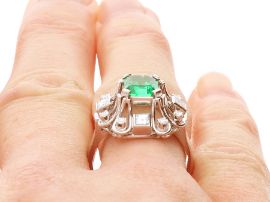 GIA Certified Emerald Ring with Diamonds on finger