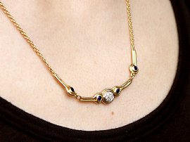 wearing Gold Sapphire and Diamond Necklace