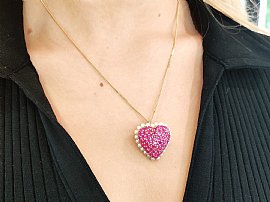 ruby heart pendant on neck