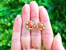 Gold and Coral Stud Earrings outside