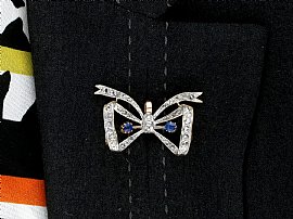 Antique Bow Brooch with Sapphires and Diamonds wearing