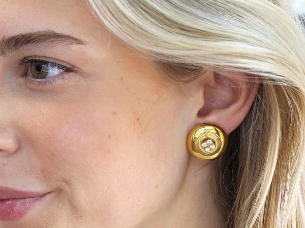 wearing gold and diamond studs 