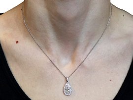 wearing platinum pear cut diamond pendant 