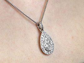 platinum pear cut diamond pendant on body