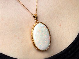 Wearing Gold Opal Pendant Necklace