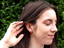 Wearing Outside Pear Cut Fire Opal Earrings