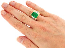 Emerald Cut Emerald Ring with Baguettes in Gold wearing 