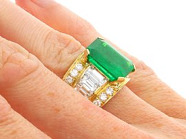 Emerald Cut Emerald Ring with Baguettes in Gold on hand