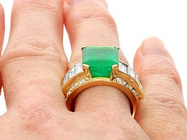 Emerald Cut Emerald Ring with Baguettes in Gold on finger