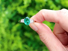 Oval Cut Emerald and Diamond Ring in Platinum