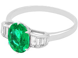 Oval Cut Emerald and Diamond Ring in Platinum