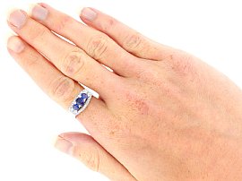 Three Stone Cushion Cut Sapphire Ring with Diamonds wearing