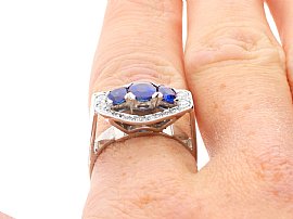 Three Stone Cushion Cut Sapphire Ring with Diamonds wearing