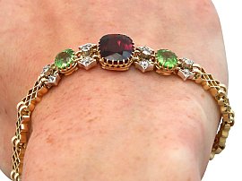 Peridot and Garnet Bracelet in Gold on wrist