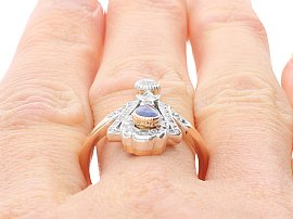 Blue Sapphire Diamond Ring in Rose Gold on finger