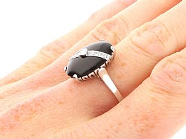 Onyx and Diamond Ring on the Finger