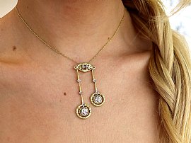 Yellow Gold Diamond Drop Pendant Necklace on neck