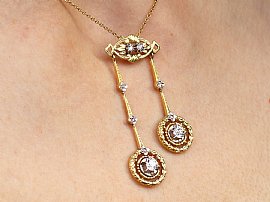 Yellow Gold Diamond Drop Pendant Necklace on neck