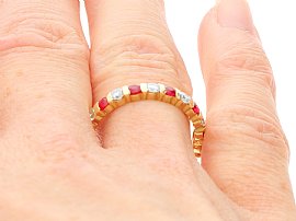 Ruby and Diamond Eternity Ring in Yellow Gold on Hand