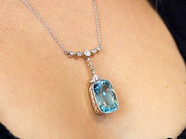 wearing Aquamarine Drop Necklace with Diamonds