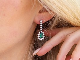 Pear Cut Emerald and Diamond Drop Earrings wearing