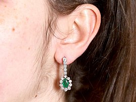 Pear Cut Emerald and Diamond Drop Earrings Wearing