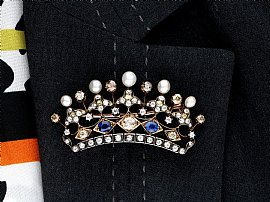 crown brooch with gemstones wearing