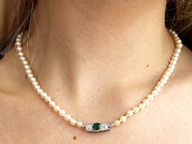 Pearl Strand Necklace with Green Sapphire Clasp wearing