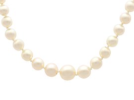 Pearl Strand Necklace with Green Sapphire Clasp