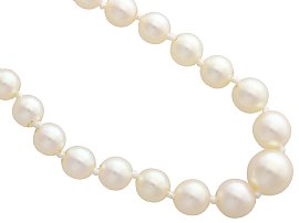 Pearl Strand Necklace with Green Sapphire Clasp