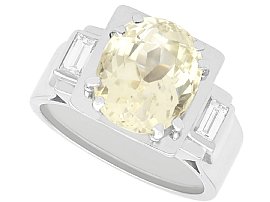 8.50ct Oval Yellow Sapphire, 0.22ct Diamond and Platinum Ring