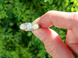 Opal Trilogy Ring in Yellow Gold outside 