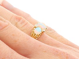 Three Stone Opal Ring in Yellow Gold on hand