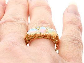 Three Stone Opal Ring in Yellow Gold on finger