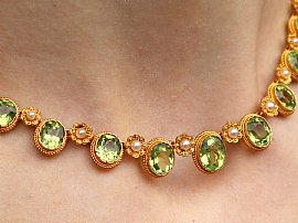 Gold Peridot Necklace with Pearls on neck 