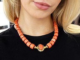 Vintage Coral Bead Necklace in Gold on neck