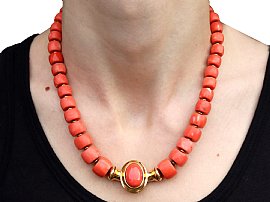 Vintage Coral Bead Necklace in Gold on neck