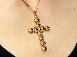 Blue Sapphire Cross Pendant on neck