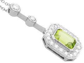 Side View of Emerald Cut Peridot Pendant with Diamonds