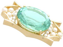 gold brooch with aquamarine and pearls